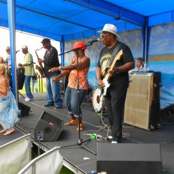 Enthusiastic female dancers join Bill Magee Blues Band on stage
